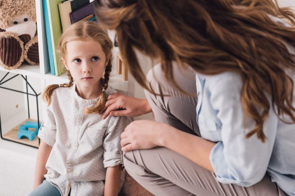 adult comforting a child with anxiety