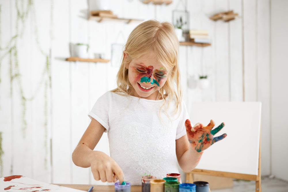 girl who painted face instead of paper