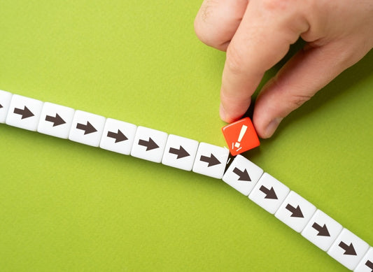 image represents flexibility with row of cubes with arrows and cube exclamation point trying to fit in